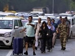 Passengers stuck in a traffic jam walk towards the airport on Sardar Patel Marg near Dhaula Kuan on Thursday. (Raj K Raj/HT Photo) Passengers stuck in a traffic jam walk towards the airport on Sardar Patel Marg near Dhaula Kuan on Thursday. (Raj K Raj/HT Photo)