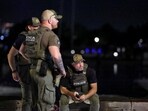 Members of the DEA and Police patrol at The Wharf after U.S. President Donald Trump's announcement of the federal take over of the Metropolitan Police Department under the Home Rule Act and the deployment of the National Guard to assist in crime prevention in the nation's capital, in Washington, D.C., U.S., August 13, 2025. REUTERS/Evelyn Hockstein