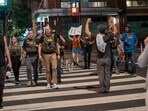 FBI agents are followed by protesters in the U street neighborhood on August 13, 2025 in Washington, DC. U.S. (Photo by Andrew Leyden / GETTY IMAGES NORTH AMERICA / Getty Images via AFP) FBI agents are followed by protesters in the U street neighborhood on August 13, 2025 in Washington, DC. U.S. (Photo by Andrew Leyden / GETTY IMAGES NORTH AMERICA / Getty Images via AFP)