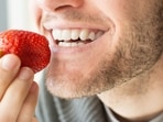 Applying strawberry to your teeth is a common DIY. Applying strawberry to your teeth is a common DIY.