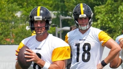 Pittsburgh Steelers quarterbacks Aaron Rodgers (8) looks to pass as Will Howard (18) waits his turn (AP) Pittsburgh Steelers quarterbacks Aaron Rodgers (8) looks to pass as Will Howard (18) waits his turn (AP)
