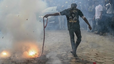 Some fans burnt firecrackers outside theatres in Chennai to celebrate the release of Coolie and the 50 years milestone. (AFP) Some fans burnt firecrackers outside theatres in Chennai to celebrate the release of Coolie and the 50 years milestone. (AFP)