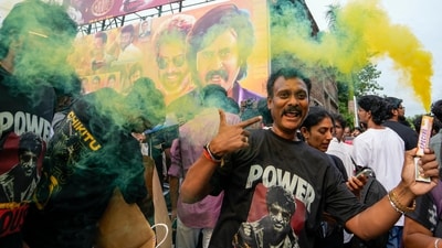 Fans looked pumped as they burnt smoke bombs while wearing ‘powerhouse’ tee-shirts to celebrate everything about Rajinikanth. (PTI) Fans looked pumped as they burnt smoke bombs while wearing ‘powerhouse’ tee-shirts to celebrate everything about Rajinikanth. (PTI)