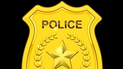 Gold Police Badge isolated on black background