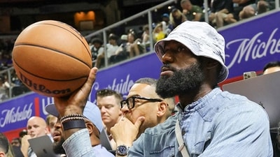LeBron James throws the ball back to a referee as he attends a 2025 NBA Summer League game between the Lakers and the New Orleans Pelicans. (Getty Images via AFP) LeBron James throws the ball back to a referee as he attends a 2025 NBA Summer League game between the Lakers and the New Orleans Pelicans. (Getty Images via AFP)