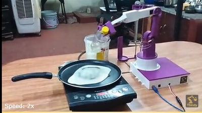 The robot, made by a Bengaluru engineer, could spread batter on a hot pan and make a crispy golden brown dosa. (Screengrab) The robot, made by a Bengaluru engineer, could spread batter on a hot pan and make a crispy golden brown dosa. (Screengrab)