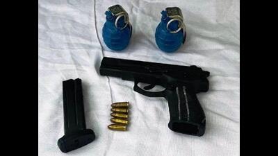 The hand-grenades, a Beretta 9mm pistol, and ammunition recovered from the Babbar Khalsa International operatives in Ferozepur on Thursday. (HT Photo)