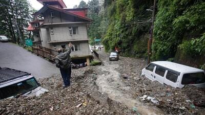 Two vehicles buried under the debris after mudslide on Lakkar Bazaar-IGMC road in Shimla on Thursday. (Deepak Sansta/HT) Two vehicles buried under the debris after mudslide on Lakkar Bazaar-IGMC road in Shimla on Thursday. (Deepak Sansta/HT)
