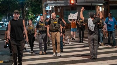 FBI agents are followed by protesters in the U street neighborhood on August 13, 2025 in Washington, DC. U.S. (Photo by Andrew Leyden / GETTY IMAGES NORTH AMERICA / Getty Images via AFP) (Getty Images via AFP) FBI agents are followed by protesters in the U street neighborhood on August 13, 2025 in Washington, DC. U.S. (Photo by Andrew Leyden / GETTY IMAGES NORTH AMERICA / Getty Images via AFP) (Getty Images via AFP)