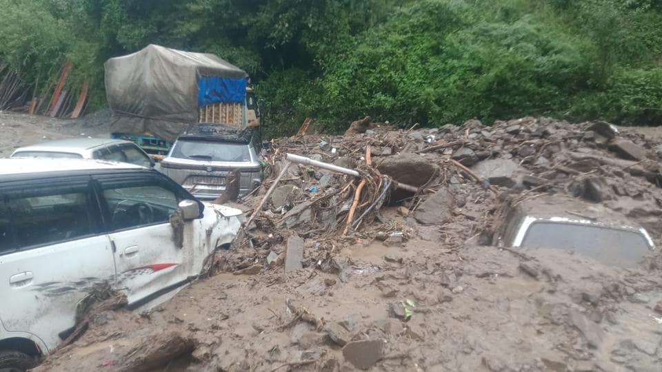Vehicles buried in debris after a flash flood at Khaltunala on the Gumma-Baghi road at Kotkhai in Shimla district on Thursday. (HT Photo) Vehicles buried in debris after a flash flood at Khaltunala on the Gumma-Baghi road at Kotkhai in Shimla district on Thursday. (HT Photo)