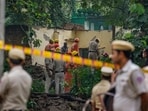 Security personnel at the site after a portion of the structure at Humayun's Tomb collapses, in New Delhi