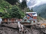 Rescuers (L) inspect the site of a flashflood at a village in Kishtwar district on August 14, 2025. Rescuers (L) inspect the site of a flashflood at a village in Kishtwar district on August 14, 2025.