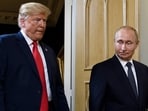 Russian President Vladimir Putin (R) and US President Donald Trump shake hands before a meeting in Helsinki on July 16, 2018.