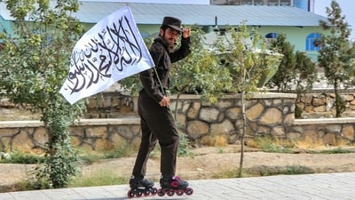 A Taliban security personnel skates along a street during a rally marking the fourth anniversary of the Taliban takeover of Afghanistan in Ghazni on August 15, 2025. (AFP) A Taliban security personnel skates along a street during a rally marking the fourth anniversary of the Taliban takeover of Afghanistan in Ghazni on August 15, 2025. (AFP)