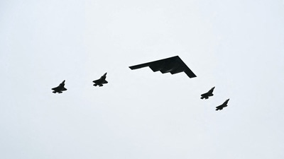 A B-2 bomber (C) and four F-35 fighter jets fly overhead as US President Donald Trump greets Russian President Vladimir Putin (AFP) A B-2 bomber (C) and four F-35 fighter jets fly overhead as US President Donald Trump greets Russian President Vladimir Putin (AFP)