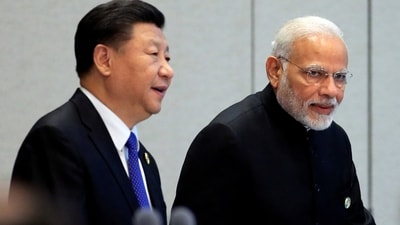 China's President Xi Jinping and India's Prime Minister Narendra Modi arrive for a signing ceremony during Shanghai Cooperation Organization (SCO) summit in Qingdao, Shandong Province, China June 10, 2018. (REUTERS)