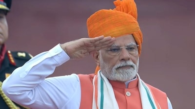 Prime Minister Narendra Modi stands for the national anthem after hoisting the national flag during the 79th Independence Day celebration at the Red Fort, in New Delhi. (PMO) Prime Minister Narendra Modi stands for the national anthem after hoisting the national flag during the 79th Independence Day celebration at the Red Fort, in New Delhi. (PMO)