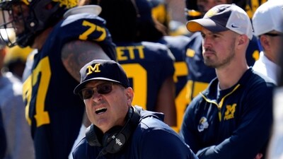 Harbaugh (left) was handed the longest show-cause order, spanning 10 years, while Stalions (right) was banned for eight years. (AP) Harbaugh (left) was handed the longest show-cause order, spanning 10 years, while Stalions (right) was banned for eight years. (AP)