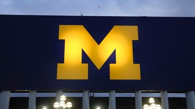 After a major NCAA ruling, Michigan faces steep penalties while ex-coach Jim Harbaugh focuses on his NFL journey with the Chargers and a shot at a Super Bowl. (AP)