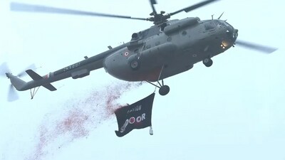 An Indian Air Force Mi-17 helicopter flying over the Red Fort with the Operation Sindoor flag during Independence Day celebrations.