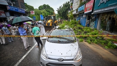 A damaged car seen as a massive tree falls on busy road amid heavy rains at Kalkaji in New Delhi. (Sanchit Khanna/ Hindustan Times) A damaged car seen as a massive tree falls on busy road amid heavy rains at Kalkaji in New Delhi. (Sanchit Khanna/ Hindustan Times)