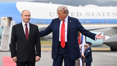 US President Donald Trump and Russian President Vladimir Putin pose for photos (AFP)