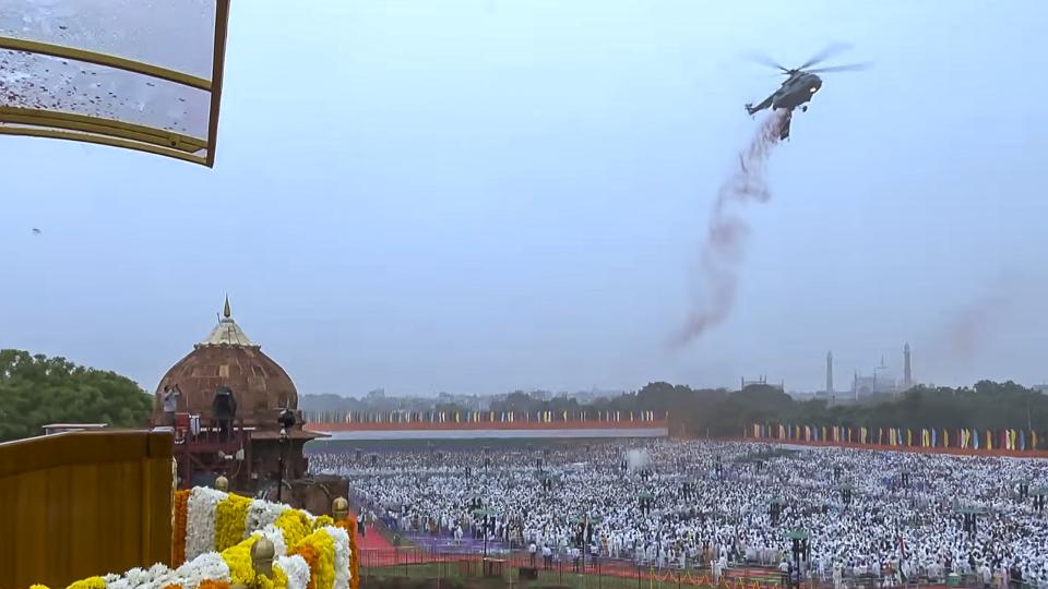 Two Mi-17 helicopters of the Indian Air Force flew over the Red Fort and showered flower petals. (PMO) Two Mi-17 helicopters of the Indian Air Force flew over the Red Fort and showered flower petals. (PMO)