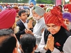 Cabinet minister Aman Arora trying to pacify the kin of freedom fighters who staged a protest at the PAU in Ludhiana on Friday. (Manish/HT)