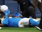 Los Angeles Chargers wide receiver Quentin Johnston is tended to during the NFL preseason game against the Los Angeles Rams.