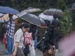 People going through the rain at Bandra in Mumbai, India