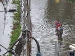 Mumbai, India - August 16, 2025: People going through the logging water at Tilak Nagar in Mumbai, India, on Saturday, August 16, 2025. (Photo by Satish Bate/ Hindustan Times) (Hindustan Times) Mumbai, India - August 16, 2025: People going through the logging water at Tilak Nagar in Mumbai, India, on Saturday, August 16, 2025. (Photo by Satish Bate/ Hindustan Times) (Hindustan Times)