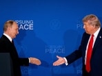 Russia's President Vladimir Putin and US President Donald Trump reach out to shake hands during a joint news conference at Joint Base Elmendorf-Richardson in Anchorage, Alaska, US, on Friday. Russia's President Vladimir Putin and US President Donald Trump reach out to shake hands during a joint news conference at Joint Base Elmendorf-Richardson in Anchorage, Alaska, US, on Friday.