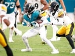 Jacksonville Jaguars wide receiver Travis Hunter (12) runs after a catch against the Pittsburgh Steelers 
