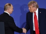 U.S. President Donald Trump, right, shakes the hand of Russia's President Vladimir Putin during a joint press conference at Joint Base Elmendorf-Richardson, Alaska.