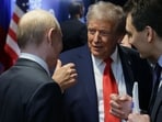 US President Donald Trump (C) and Russian President Vladimir Putin (L) speak after delivering a joint press conference following a US-Russia summit on Ukraine at Joint Base Elmendorf-Richardson in Anchorage, Alaska, on August 15, 2025. 