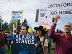 Demonstrators showing support for Ukraine at Delaney Park Strip in downtown Anchorage.
