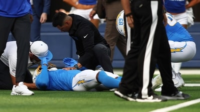 Los Angeles Chargers wide receiver Quentin Johnston is tended to during the NFL preseason game against the Los Angeles Rams. (AP) Los Angeles Chargers wide receiver Quentin Johnston is tended to during the NFL preseason game against the Los Angeles Rams. (AP)