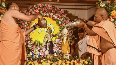 Monks performed rituals on the eve of the Krishna Janmashtami festival, at the ISKCON Temple, in Mangaluru, Karnataka. (PTI)