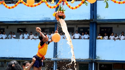 Students dressed up as Krishna and Govindas break Handi to celebrate Janmashtami at Mumbai's R.F.Naik Vidyalaya and Junior College. (Bachchan Kumar/Hindustan Times)