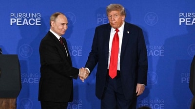 US President Donald Trump (R) and Russian President Vladimir Putin shake hands at the end of a joint press conference at Alaska summit. (Photo by Drew ANGERER / AFP) (AFP) US President Donald Trump (R) and Russian President Vladimir Putin shake hands at the end of a joint press conference at Alaska summit. (Photo by Drew ANGERER / AFP) (AFP)