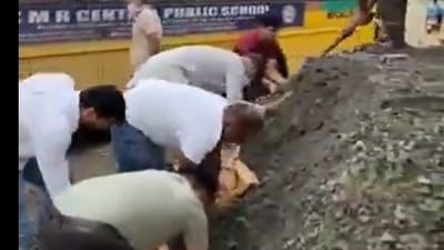 Residents of Bengaluru apartment fix potholes for themselves. Residents of Bengaluru apartment fix potholes for themselves.