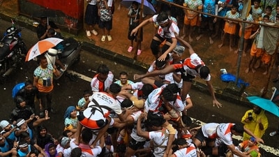 Govindas break the Dahi Handi by forming a human pyramid on the occasion of Gokulashtami festival in Mumbai's Dadar on August 16, 2025. (HT photo/ Raju Shinde)