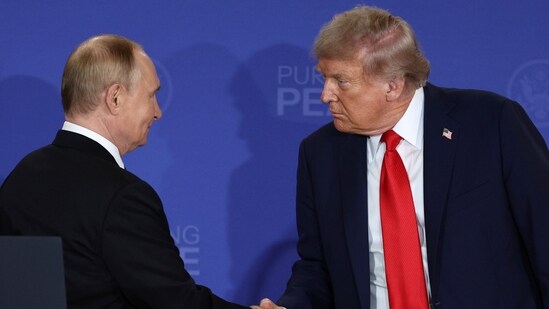 U.S. President Donald Trump, right, shakes the hand of Russia's President Vladimir Putin during a joint press conference at Joint Base Elmendorf-Richardson, Alaska. (AP)