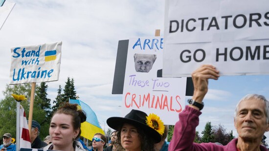 Demonstrators showing support for Ukraine at Delaney Park Strip in downtown Anchorage.