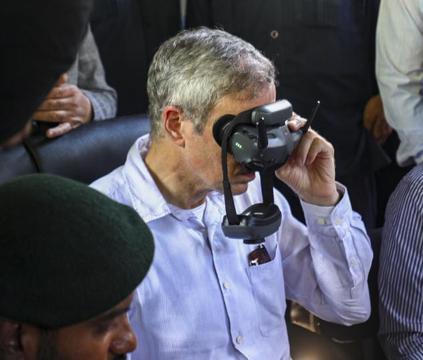 Chief minister Omar Abdullah using a virtual reality headset while being briefed about the destruction due to the flash flood in Kishtwar. (PTI Photo) Chief minister Omar Abdullah using a virtual reality headset while being briefed about the destruction due to the flash flood in Kishtwar. (PTI Photo)