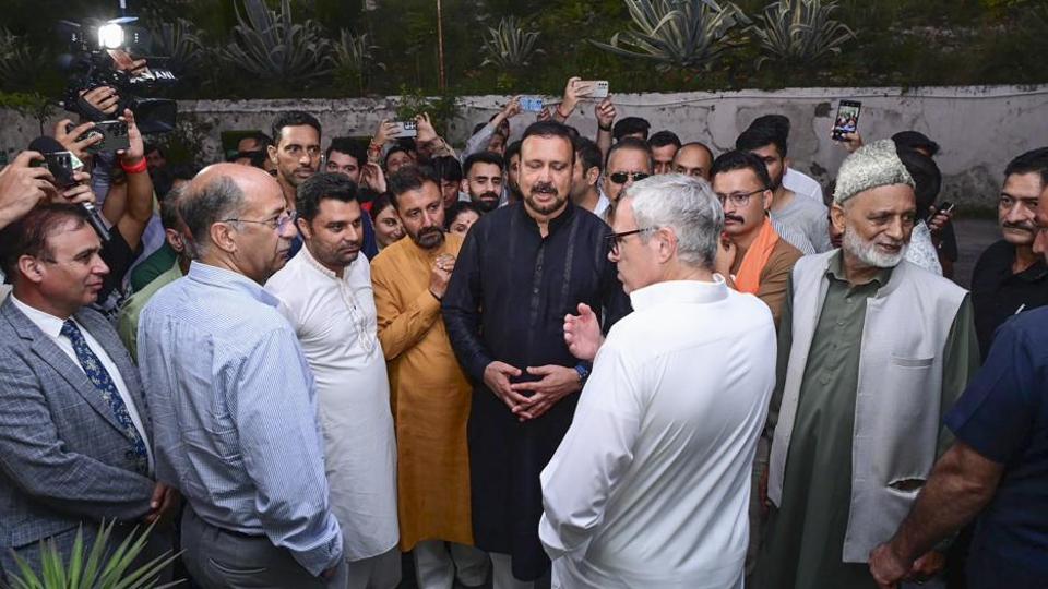 Chief minister Omar Abdullah interacting with local residents at Chasoti village in Kishtwar district on Friday night. (X)