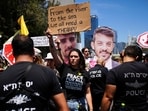 Demonstrators block a road during a protest demanding the immediate release of hostages held by Hamas and calling for the Israeli government to reverse its decision to take over Gaza, in Tel Aviv, Israel, on Sunday, August 17. Demonstrators block a road during a protest demanding the immediate release of hostages held by Hamas and calling for the Israeli government to reverse its decision to take over Gaza, in Tel Aviv, Israel, on Sunday, August 17.
