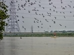 The Yamuna River in Delhi was flowing above the “warning” level of 204.5 metre on Sunday.