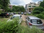 Vehicles at a park near Vikaspuri in New Delhi in July. (RAJ K RAJ /HT PHOTO)