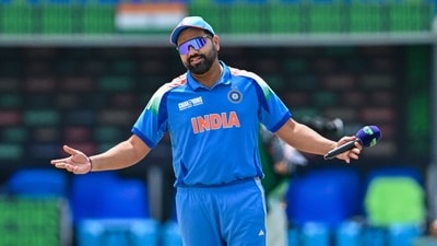 India's captain Rohit Sharma reacts after the toss before the start of a ICC Champions Trophy match (AFP)